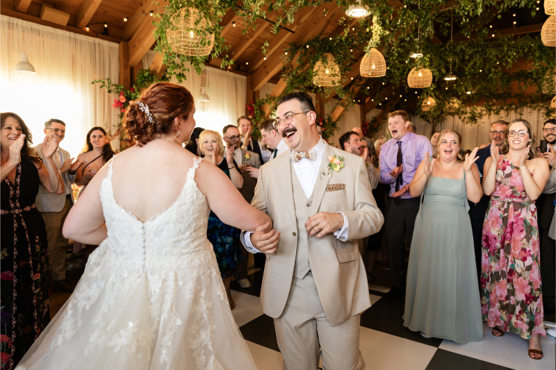 Bride and groom share huge smiles as they reunite after the Hora.