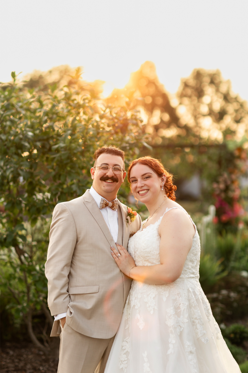 Bride and groom pose for portraits at The Lake House on Canandaigua.