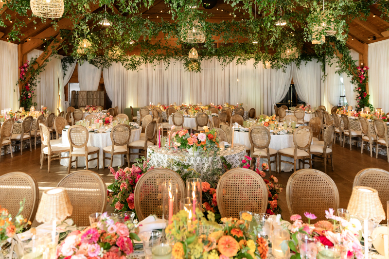 Summer camp wedding decorated with colorful florals.