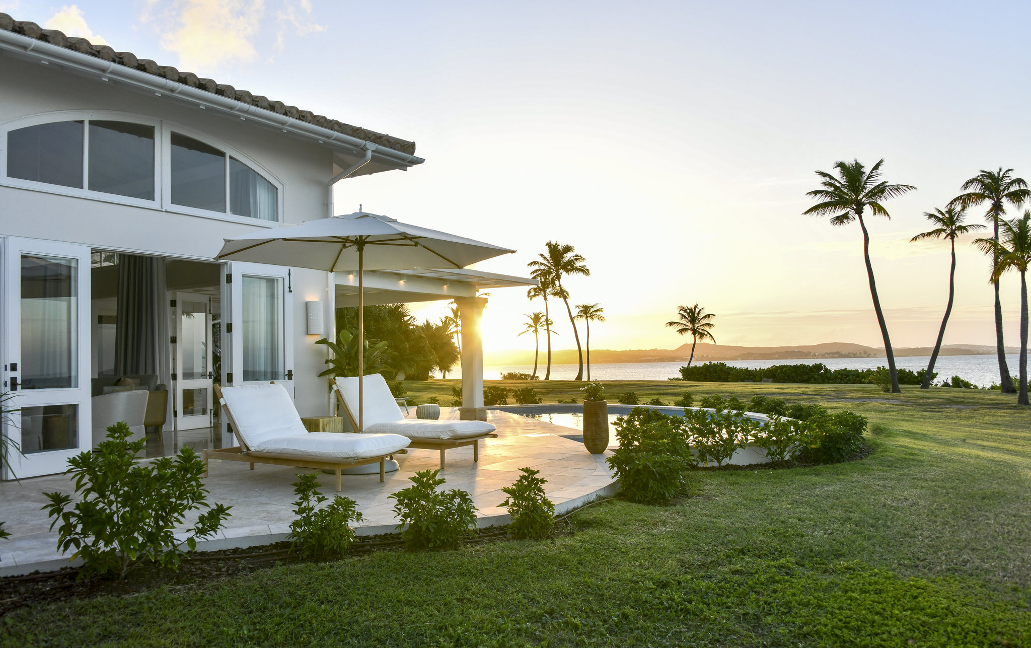 Suites at Jumby Bay Island with views of the ocean.