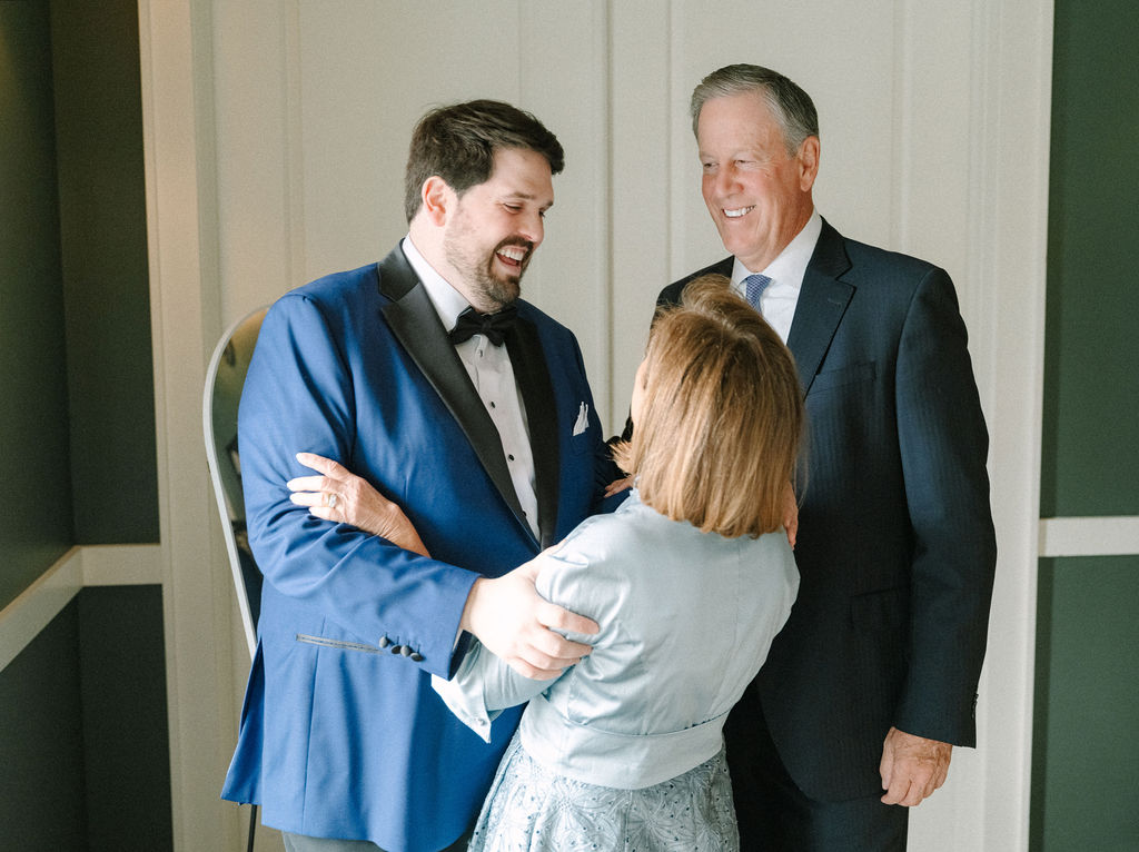 Groom hugs his mother before wedding at The Lake House on Canandaigua.