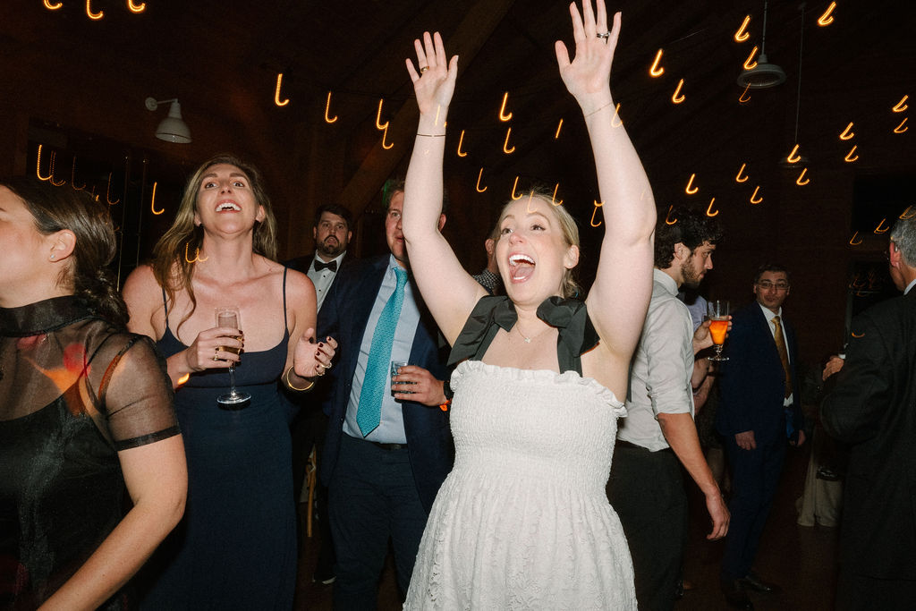 Bride and groom dance with their guests at their wedding reception at The Lake House on Canandaigua.