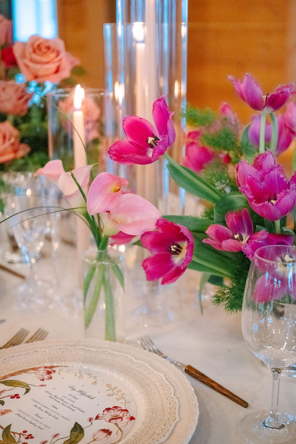 Tulip bud vases sitting on reception table for a dutch-inspired spring wedding.