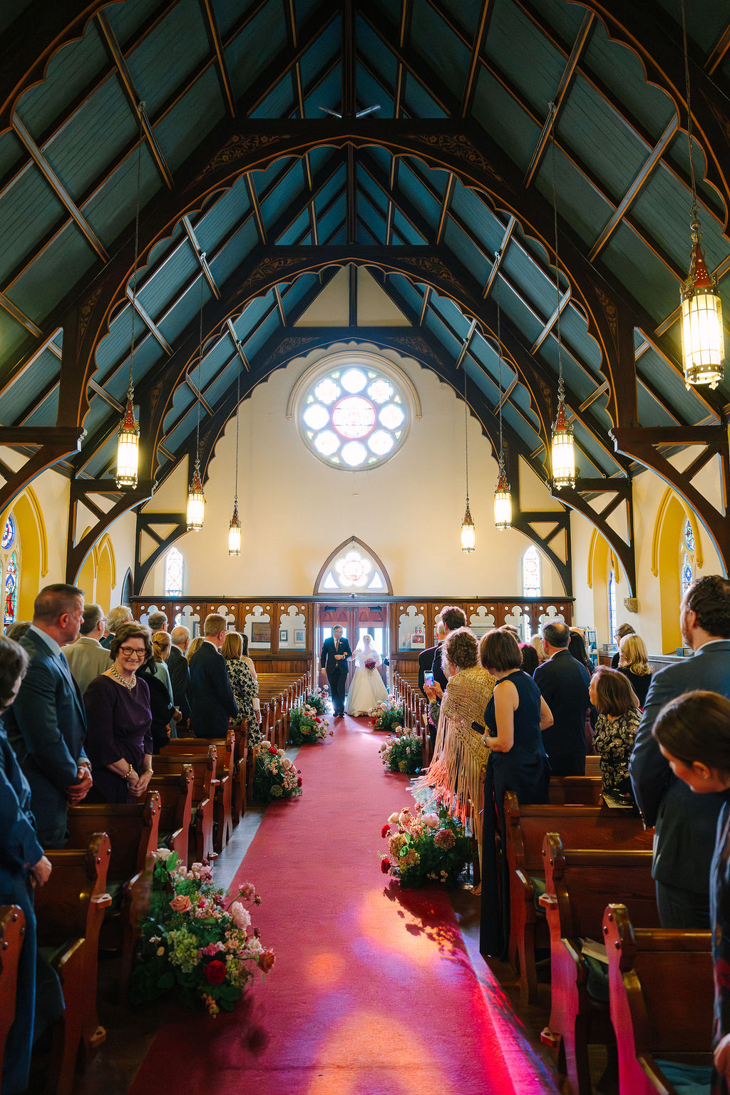 Bride entering church for wedding ceremony.